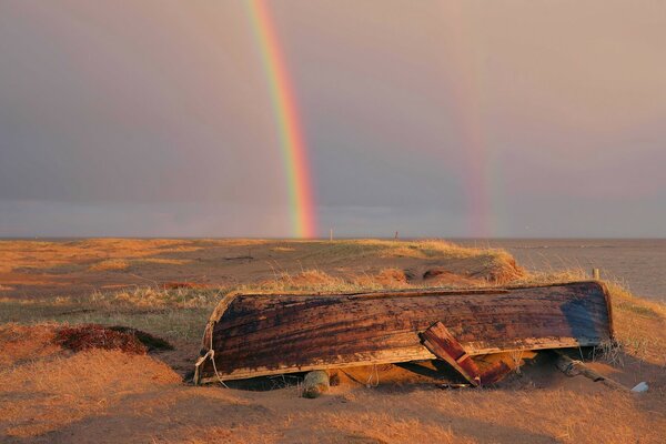 Double rainbow at the abandoned boat