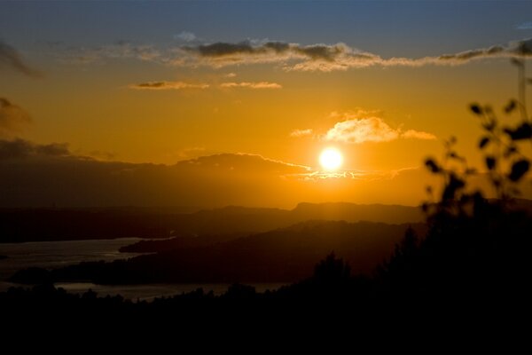 Sunset fiery sun in the mountains