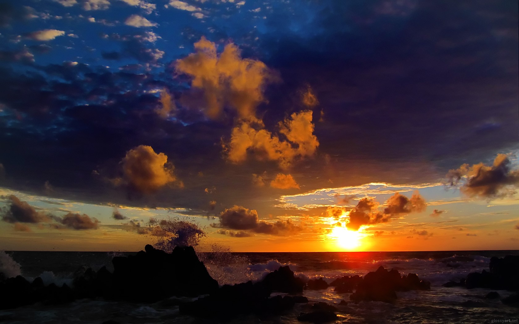 mare onde pietre cielo tramonto