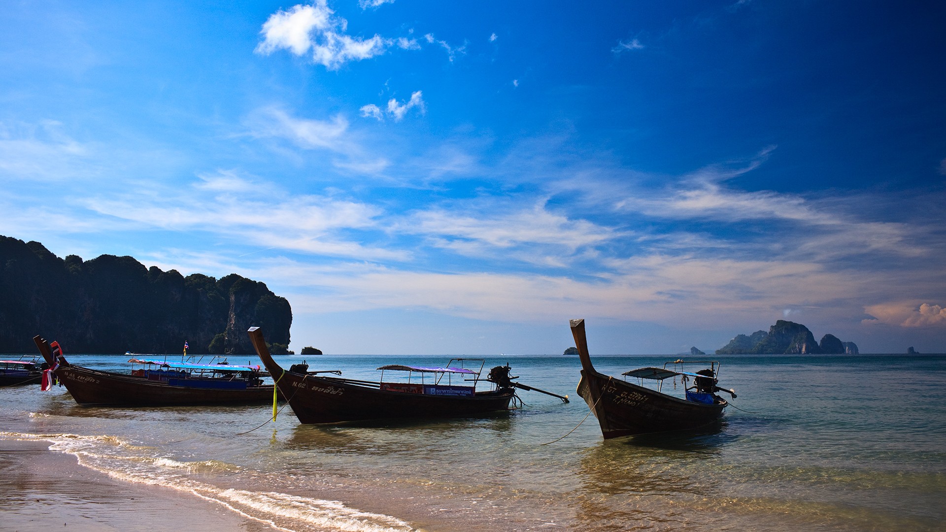 thaïlande longboat soleil mer montagnes