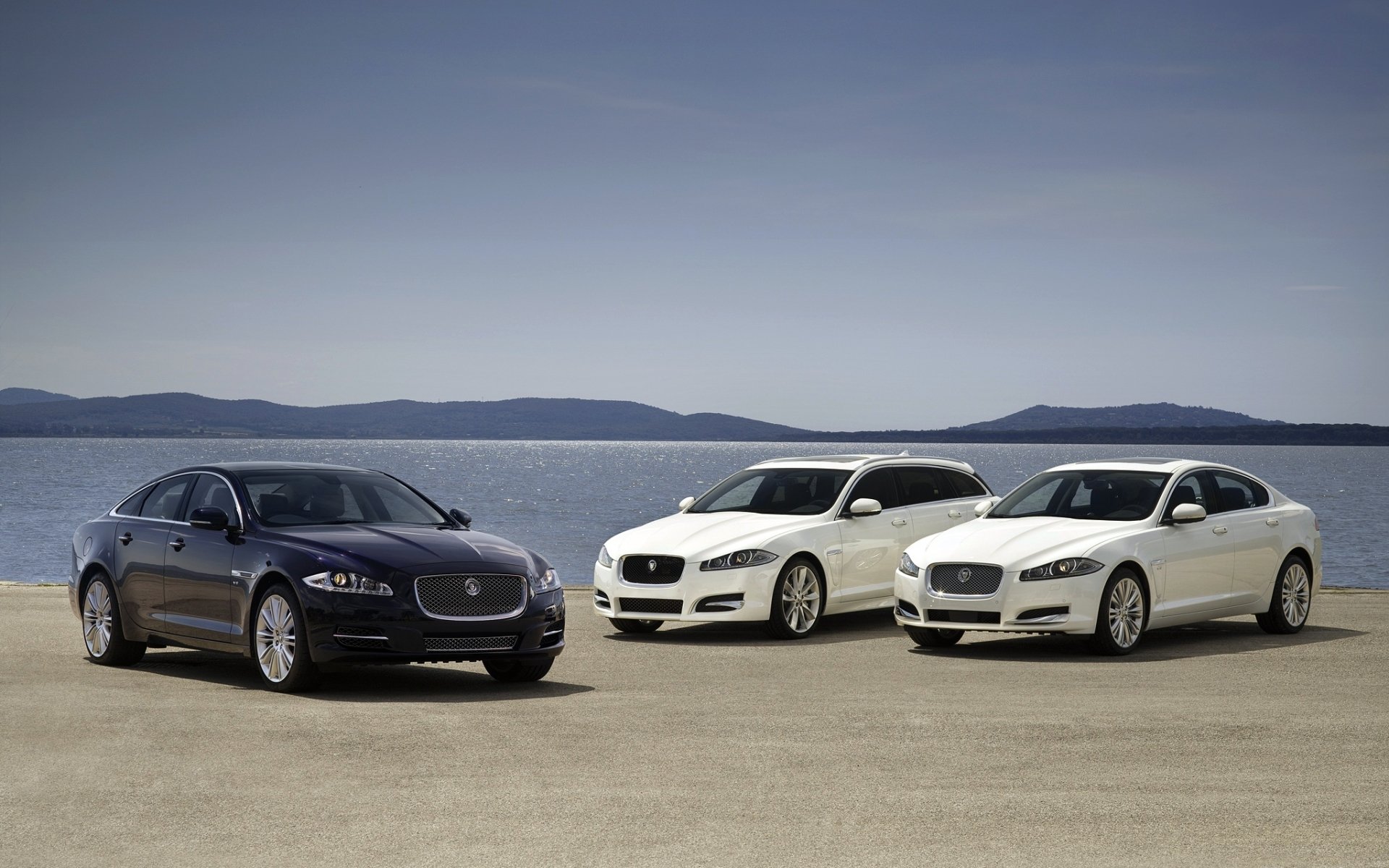 jaguar xj xf jaguar ixj ixef sedan station wagon blue white front water horizon sky