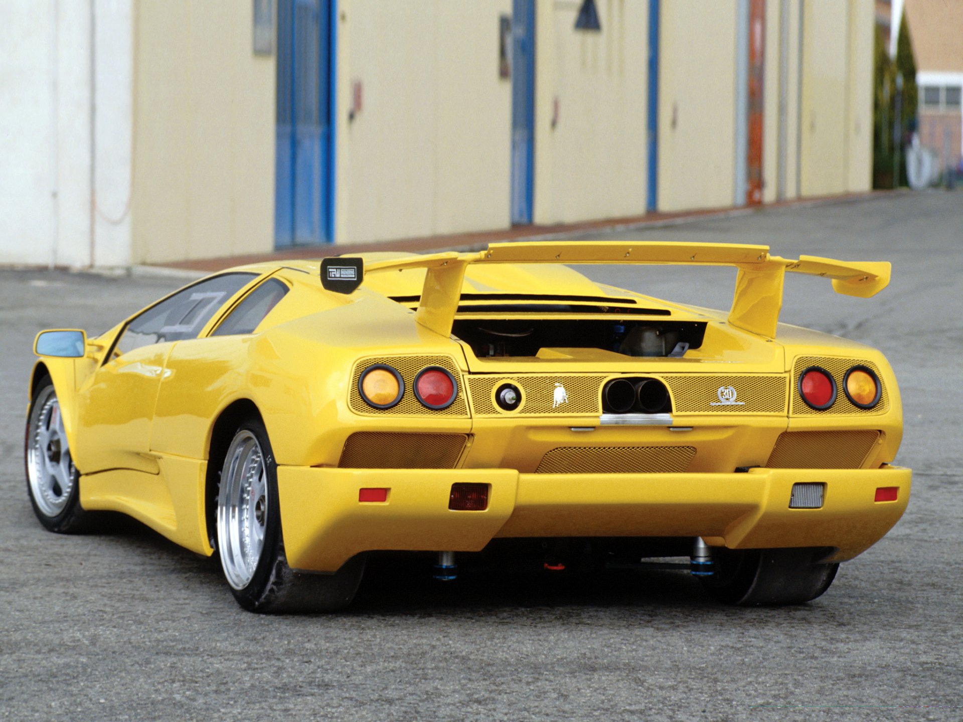 lamborghini diablo rear view lambo yellow building spoiler