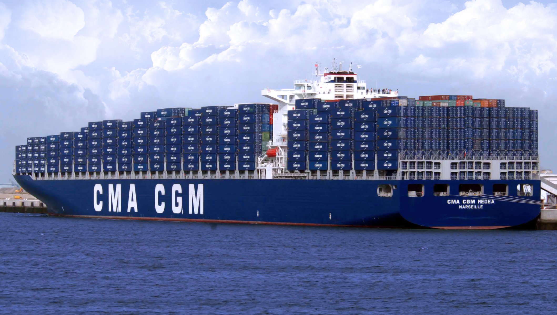 cma cgm medea ships container pier sea trucks board blue cloud