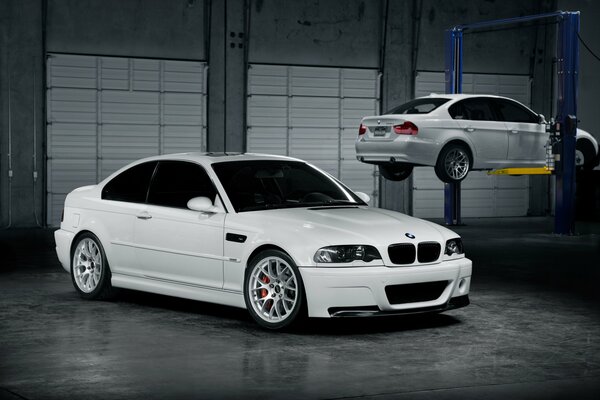 White BMW in a dark workshop