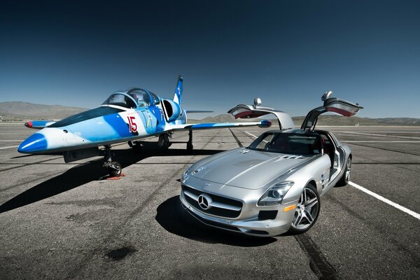 Luxury Mercedes-Benz AMG sports car on the background of a fighter