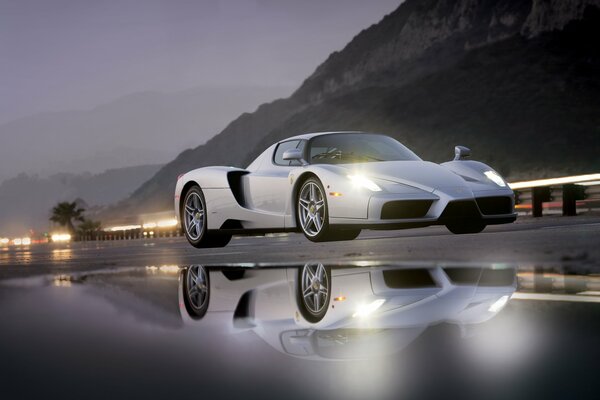 A white Ferrari. Super car outgrowth in the water