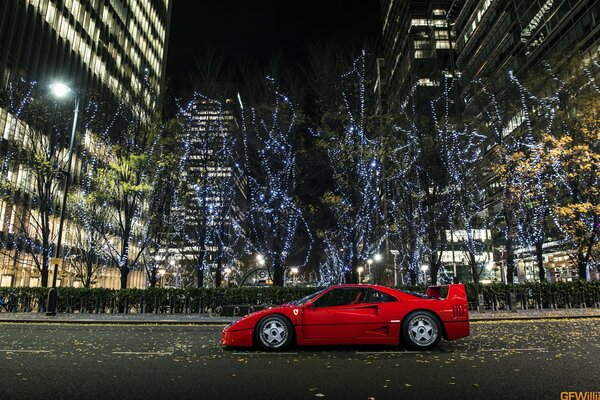 Red Ferrari at night in the city