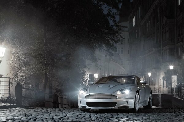 Gray car on the street of the night city