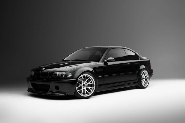 Black BMW on a black and gray background