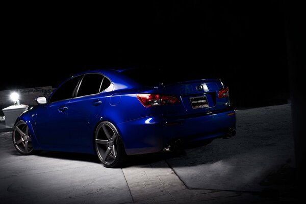 Blue Lexus rear at night