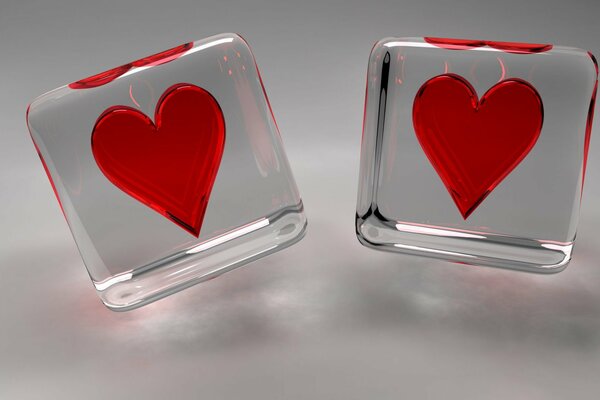 Corazones ardientes rojos en cubos transparentes