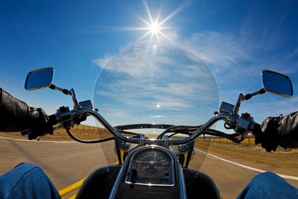 Views from a motorcycle at speed under the scorching sun