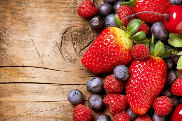 Berry composition on a wooden background