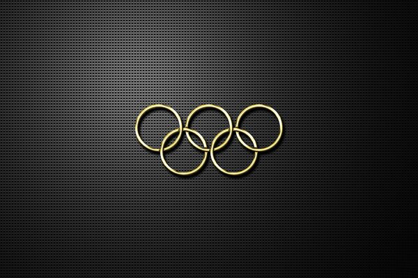 Olympic gold-plated rings on a black background