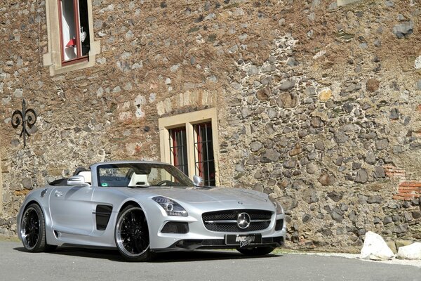 Mercedes on the background of an old building