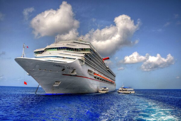 White cruise ship sailing on the sea