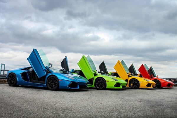 Multicolored supercars with open doors