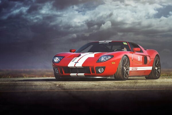 Sporty red Ford with white stripes