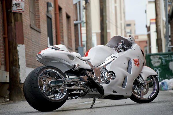 White sport bike with chrome wheels