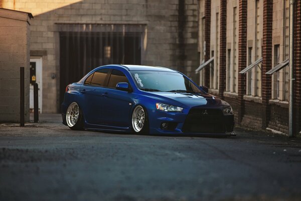 Understated Mitsubishi parked in the yard