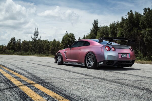 A tuned Nissan on a forest road