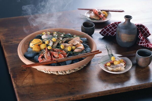 Chinese shrimp dish served with chopsticks and bowls