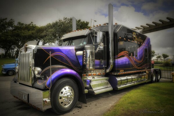 A tuned truck on an asphalt road