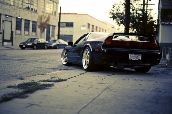 Urban landscape with black cars