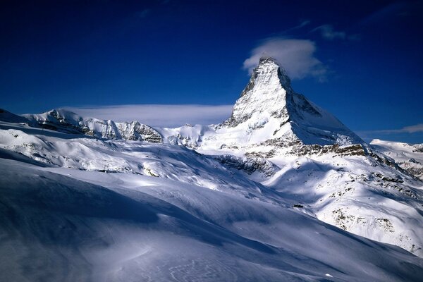 Swiss snowy mountains and the sun