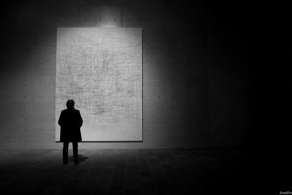 Black and white silhouette against a wall background