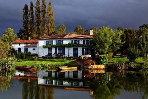 House on the shore of the lake boat pier