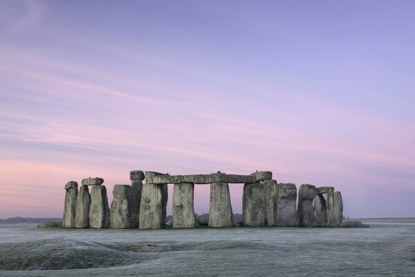 Piles of stones on the background of a pink sunset