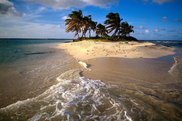 An island in the ocean against the sky