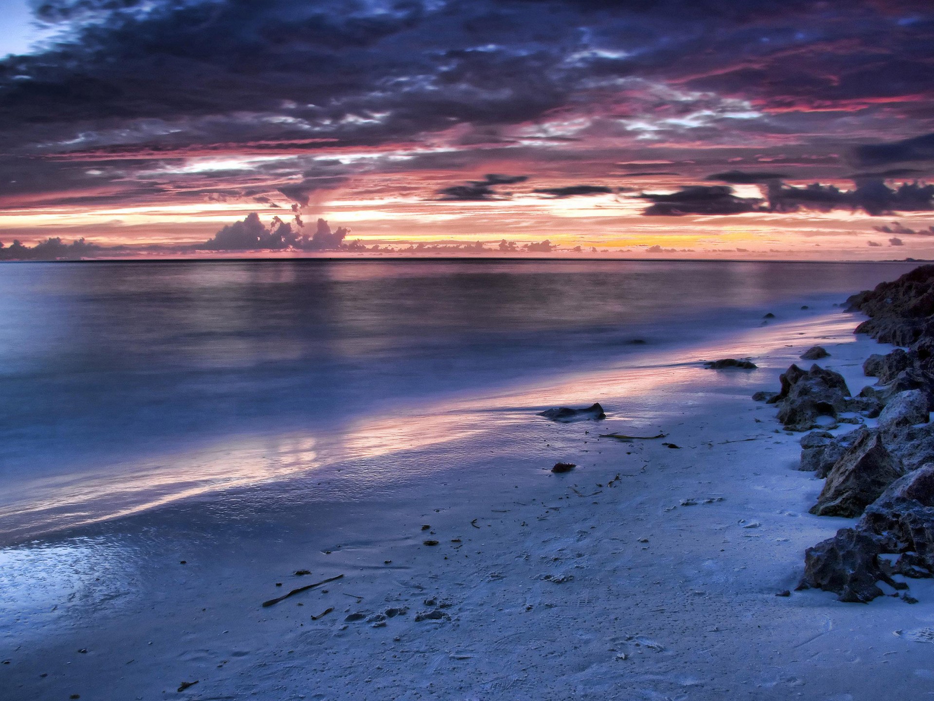 night landscape sea sky sunset stones sand beach surface of