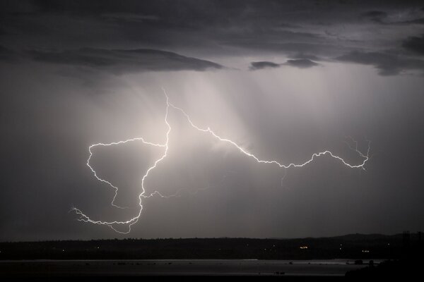 Lightning strike in the night, torrential rain