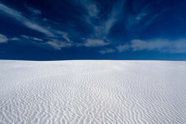 White desert against a blue sky