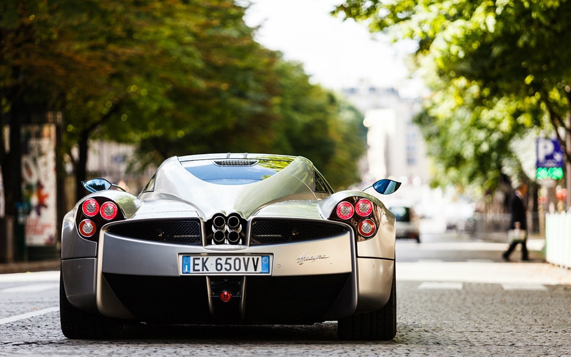 pagani huayra back of supercar on the street silver