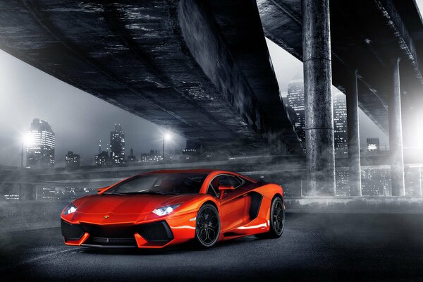 Orange lamborghini in the light of the night city