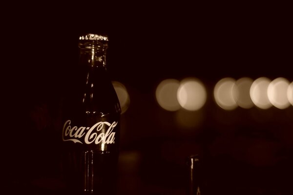 Black Coca Cola in a glass bottle