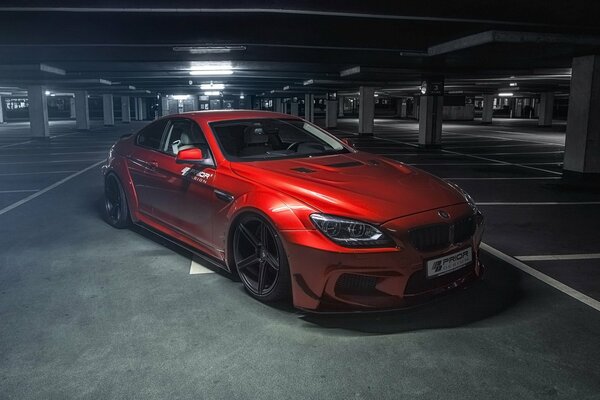 Red car in the underground parking lot