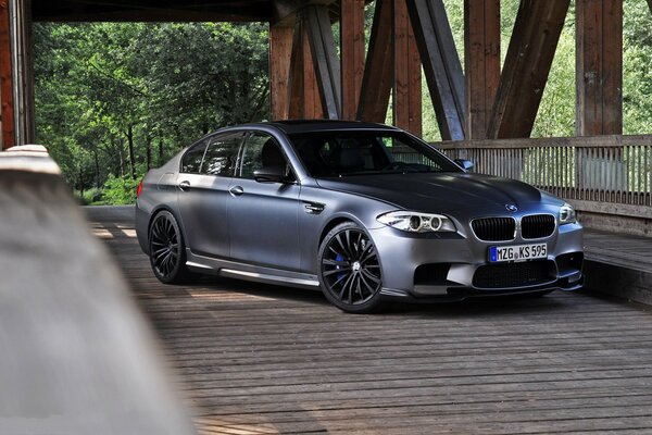 Grey matte BMW on the bridge