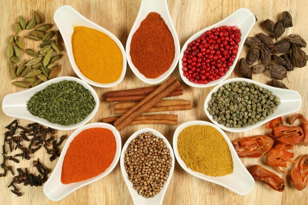 Photo of spices on the table. Different spices of the world on the table