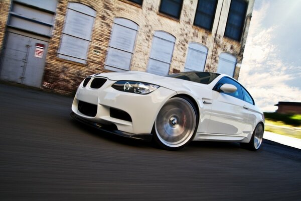 Side view of the bmw m3 e92 car under daylight on a background of clouds