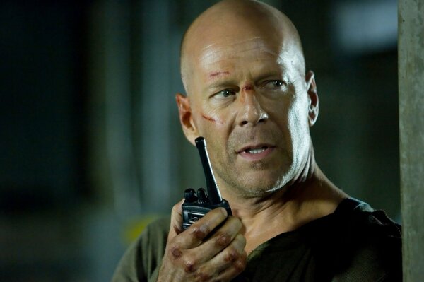 Bruce Willis with a walkie-talkie