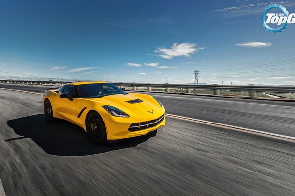 Yellow Chevrolet on the road with a blue sky