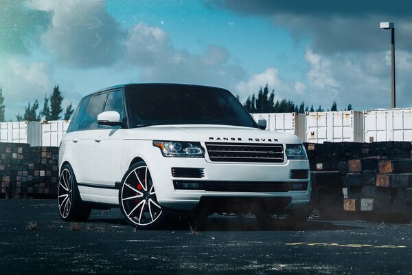 White range rover against the sky