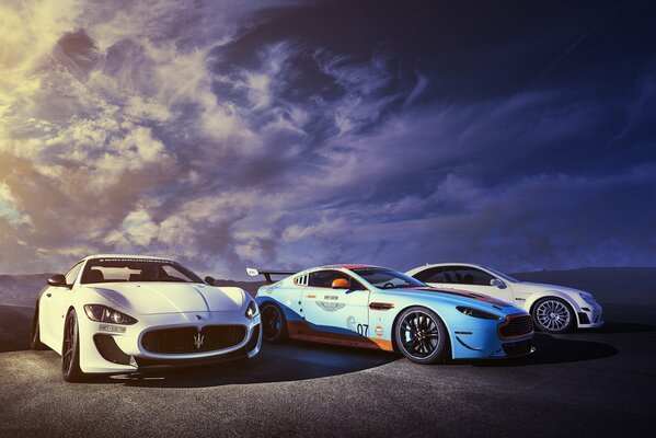 Three sports foreign cars on the highway