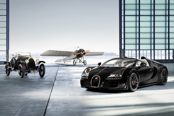 Bugatti veyron, an old car and a rare plane in a hangar