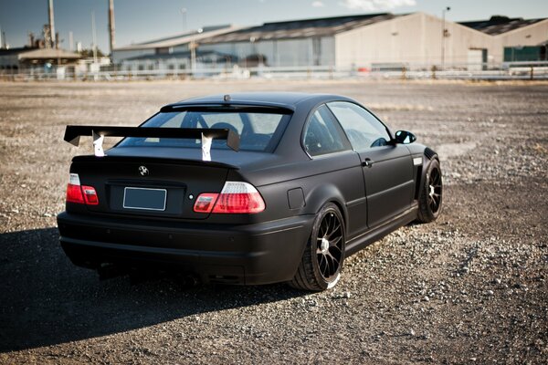 Just a black car on a rural road