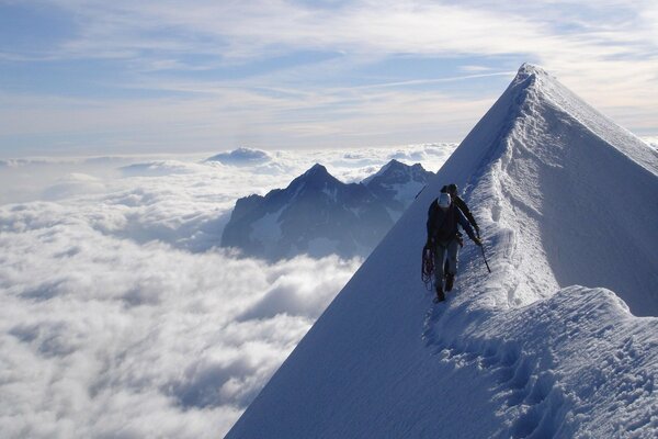 People walk on top of the mountain in winter